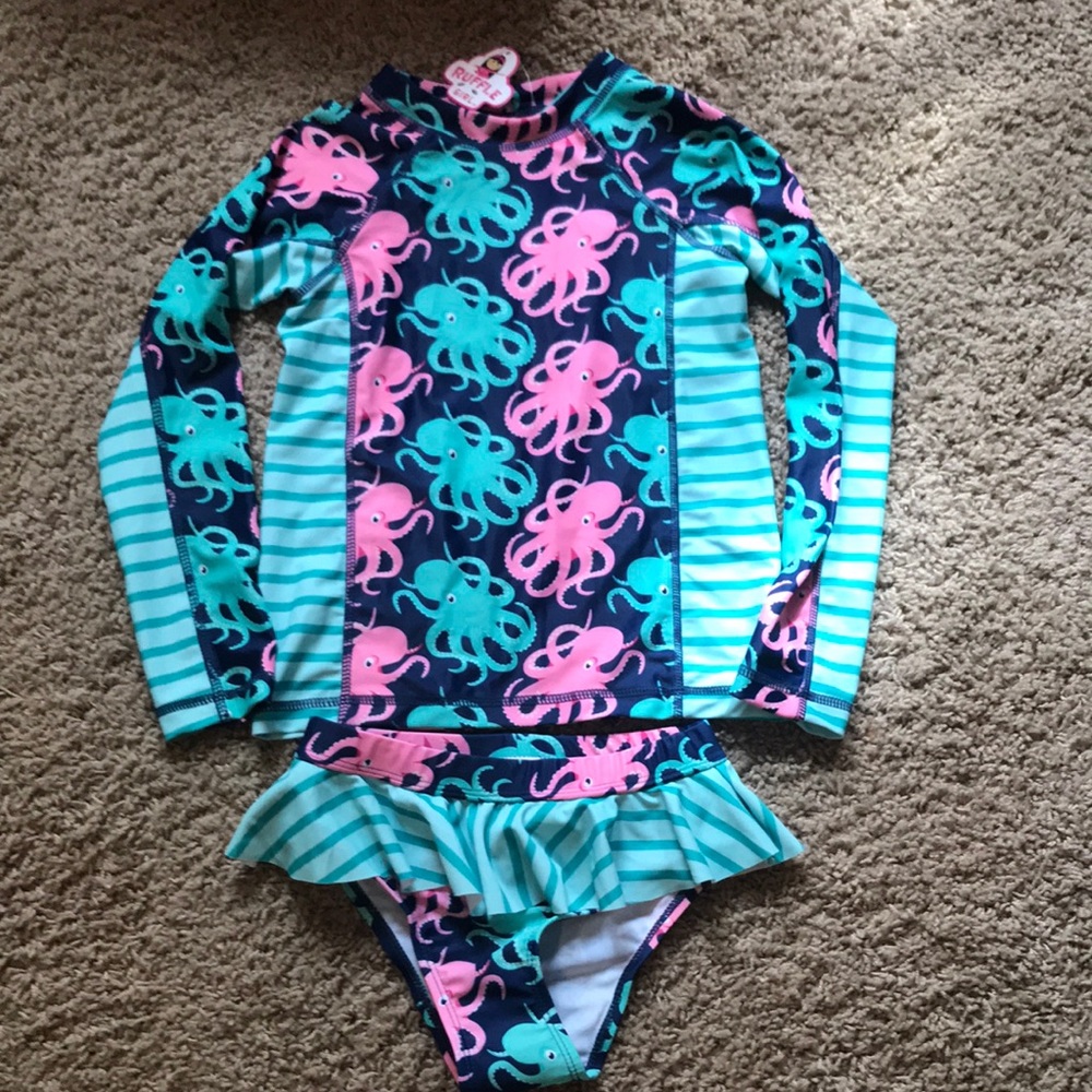 NWT. Ruffle Girl rash guard suit. Size 8.